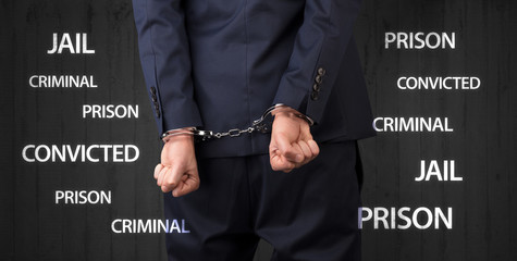 Jail convicted prison criminal labels with close handcuffed man
