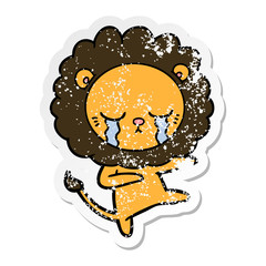 distressed sticker of a crying cartoon lion