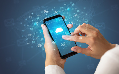 Female hand using smartphone with cloud, message and global concept
