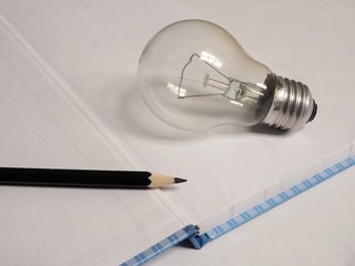 light bulb and pencil on white background