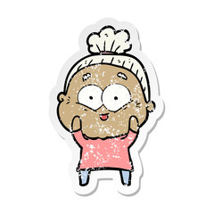 distressed sticker of a cartoon happy old woman
