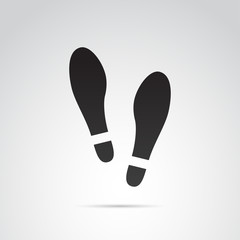 Human footprints in shoes vector icon.