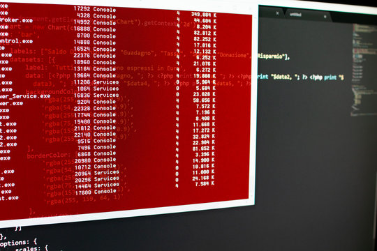Scanning hard drive content by a shell. Computer analysis in a red window. List of file and number runs fast in a window, black backgournd with lines of code