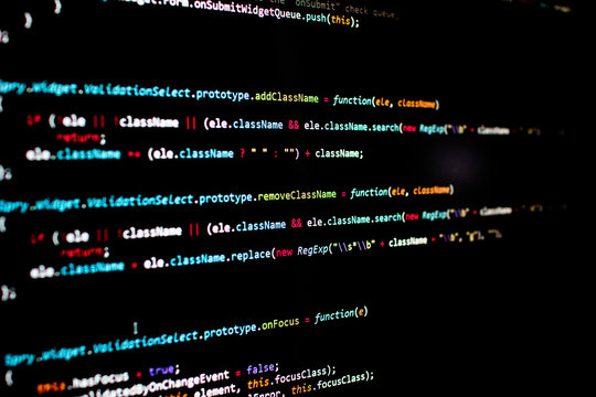 javascript lines of code into a library for website application. Script language in a software developed for internet and webistes. Black background with colored lines of code. Javascript instructions