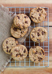 Chocolate chip cookies on the sieve on wood table.