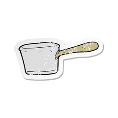 retro distressed sticker of a cartoon kitchen pan
