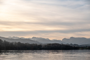 Evening light over the Great Langdale skyline; from left to right, Crinkle Grags, Bowfell and the Langdale Pikes seen over Windermere, Lake District, UK