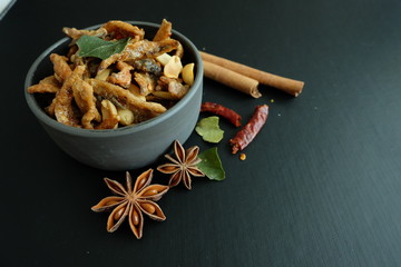 Fototapeta premium Fried fish with herbs and nuts. Appetizer Thai food. 