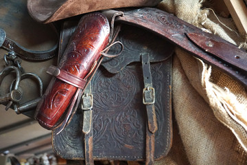 Brown Cowboy hat horse saddle leather hat and sacks western american vintage style 