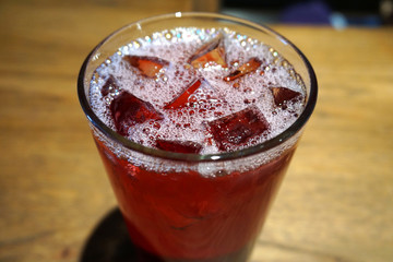 Beautiful delicious cranberry juice cocktail alcohol in glass with ice cube white foam jam jar beverage summer time in party lemonade gin tequila on wooden table ice cold glass  