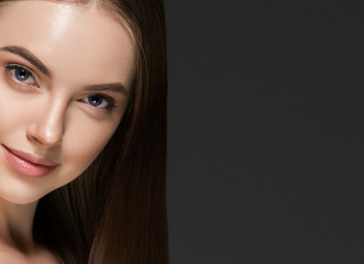 Naklejka premium Beauty woman face hair skin healthy closeup over gray background