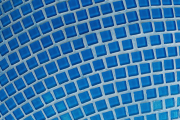 Blue glass mosaic in the bathroom. Pattern and texture of mosaic tiles.