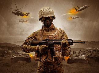 Armed soldier with sniper in the middle of a war
