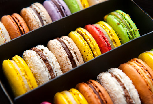 close up of colorful macaroons as background