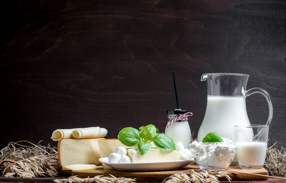 Many Fresh Dairy Products In Front Of A Rustic Vintage Background