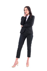 Confident successful business woman with folded arms smiling at camera. Full body isolated on white background. 