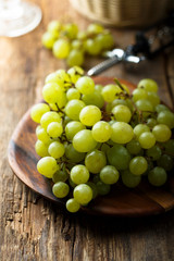 Ripe white grape on wooden desk