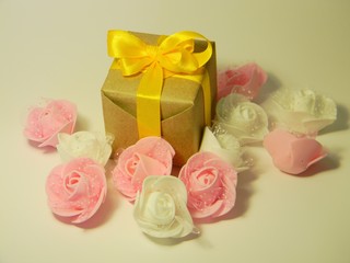 Small present box on a white background. Kraft paper. Suitable for International Womens Day. 8 march
