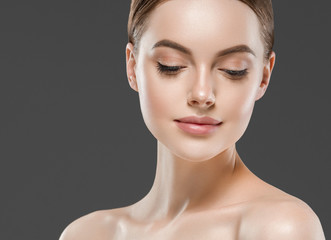Healthy skin woman beautiful face close up over gray background