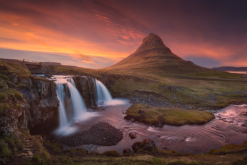 Kirkjufellfoss waterfall and Kirkjufell mountain on north coast of Snæfellsnes peninsula in Iceland