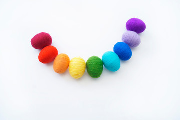 Easter eggs knitted from wool. Manual work. Rainbow. Easter.