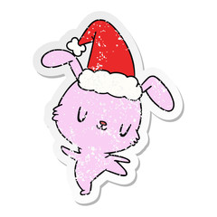christmas distressed sticker cartoon of kawaii rabbit