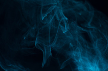 Blue smoke on black background