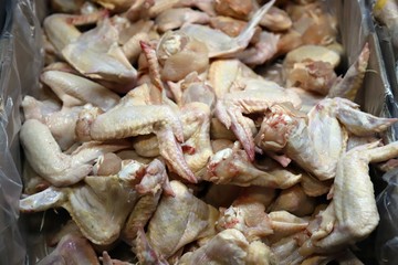 Preparation of chicken wings on chopping board finishing.turkey -