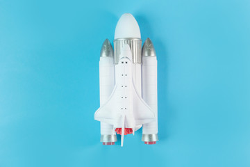 The  close up image space ship on blue background.