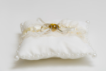 Silk pillow embroidered with pearls for wedding rings ivory color close up