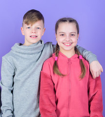 Teens friends. Girl and boy true friendship. Children smiling faces on violet background. Friends hug. Childrens day. Cheerful youth. Relations and friendship. Happy to have such good friends