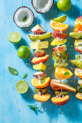 Tasty skewers with mix of fruits for snack