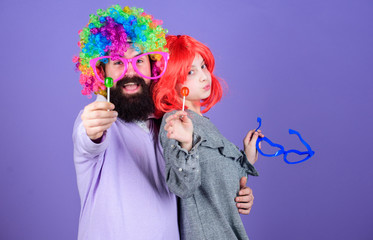 A joy that never ends. Birthday party. Father and girl child enjoying birthday celebration. Happy birthday. Father and daughter in party style wigs. Happy family celebrating birthday