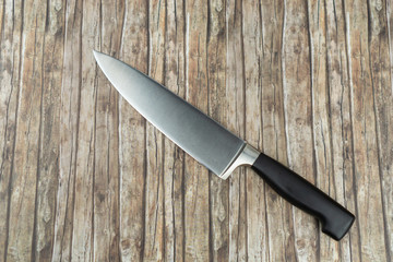 Butchers knife on wooden background