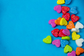 A multicolored hearts shape  on blue sky background, image using for valentine ‘s day signs and lovely sweet concept