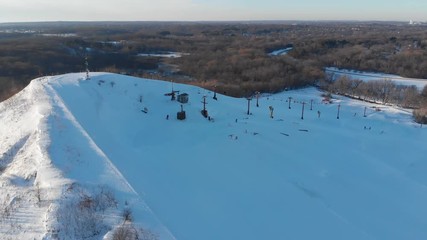 Snow park in Wisconsin, winter activities (tubing, skiing, snowboarding). Drone shots , bird's eyes view