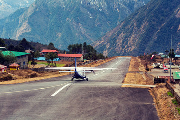 Lukla airport. In the frame of the airport runway and taking off the plane. Nepal. Everest trekking.