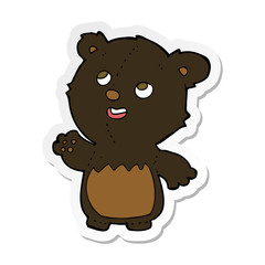 sticker of a cartoon happy little teddy black bear