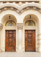 Fototapeta premium Ancient painted wooden door with ornaments