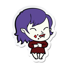 sticker of a cartoon vampire girl with blood on cheek