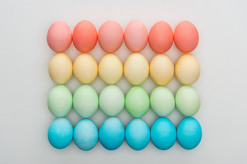 top view of traditional colorful easter eggs on grey