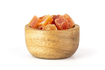 Lot of slices of dry papaya with wooden bowl isolated on white background