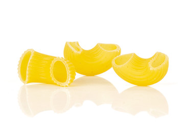 Group of three whole raw pasta pipe rigate variety isolated on white background