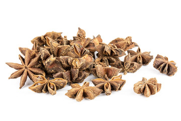 Lot of whole dry brown star anise fruit isolated on white background