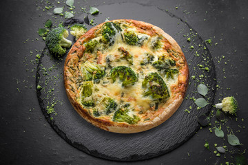 Vegetable quiche with broccoli and cheese. Vegetarian pie.