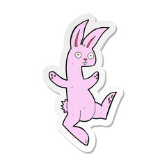 sticker of a funny cartoon pink rabbit