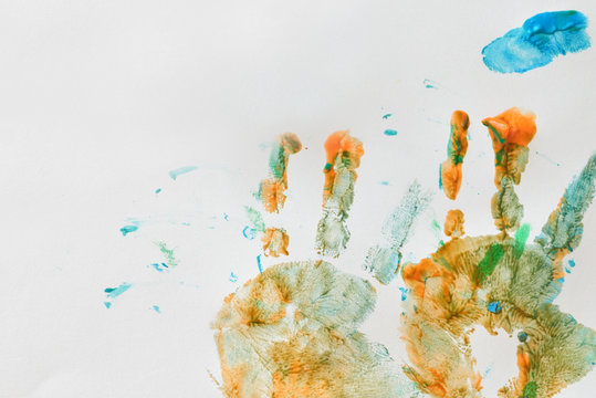 Colorful hand prints of toddler kid on white background. Set of rainbow colored hand prints.