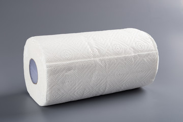 brand new paper roll for kitchen on grey background