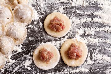 cooking dumplings on mug of dough is ball of minced meat