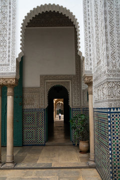 Man wanders down a long corridor decorated in Moorish style, Mahkama du Pacha, former Law Courts, Casablanca, Morocco
